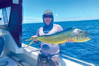 Frank Schlechtreim with a dolphin fish, caught offshore out of Moreton Island, a catch he describes as ‘opportunistic’ while fishing for snapper.