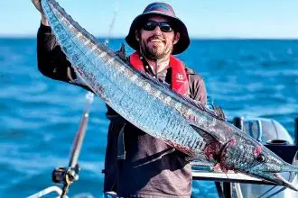 QUITE THE CATCH: Adam Neeson with a 16.5kg wahoo, caught last year off North Stradbroke Island.