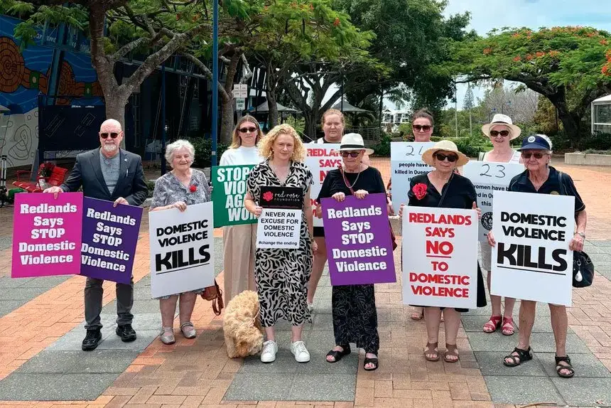 Residents, State Member for Oodgeroo Amanda Stoker and Red Rose Foundation CEO Brian Sullivan gathered in Cleveland CBD to honour victims of domestic violence.