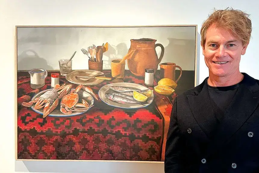 Finalist judge Steven Alderton with Redland Art Awards 2024 winning artwork Seafood Still Life for Margaret, 2023, Oil. PHOTO: Courtesy of Redland Art Gallery
