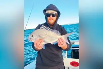 Cameron Turvey with a squire caught off Green Island last year.