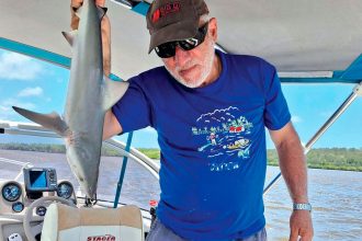 Joe Greco with a black tip shark, suitable for eating, caught in Hervey Bay.