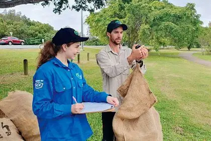 OzFish volunteers clean up water from Saltwater Creek.