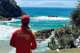 Point Lookout lifeguard Mitch Yates operates the drone being used as part of the SharkSmart campaign at Point Lookout, North Stradbroke Island.