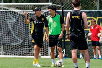 Paul Lambert works with defender Nathan Geyer in his new role at Wynnum Wolves.