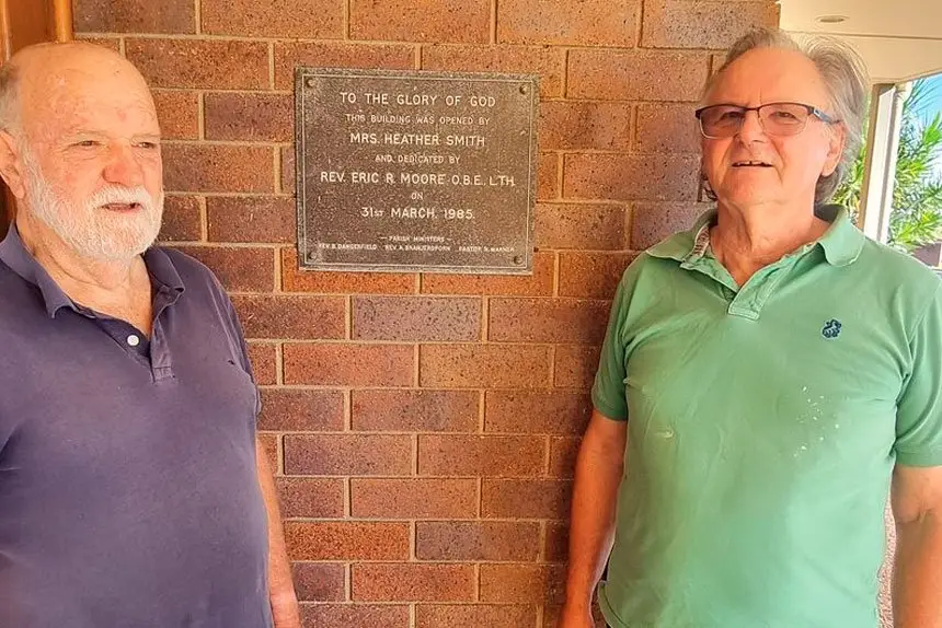 Ian Tully and Neil Gilmour celebrate the Trinity Uniting Church’s 40th anniversary on its Marlborough Rd site. Their families were among those attending in 1983, the year the original church burnt down.