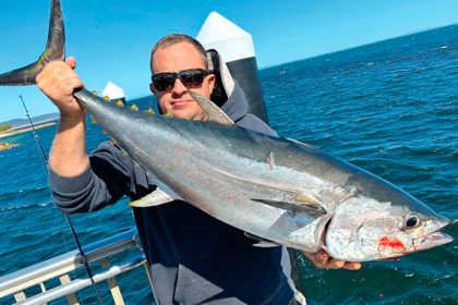GOOD CATCH: Brent Greco with a long tail tuna caught at Amity Point, North Stradbroke Island.
