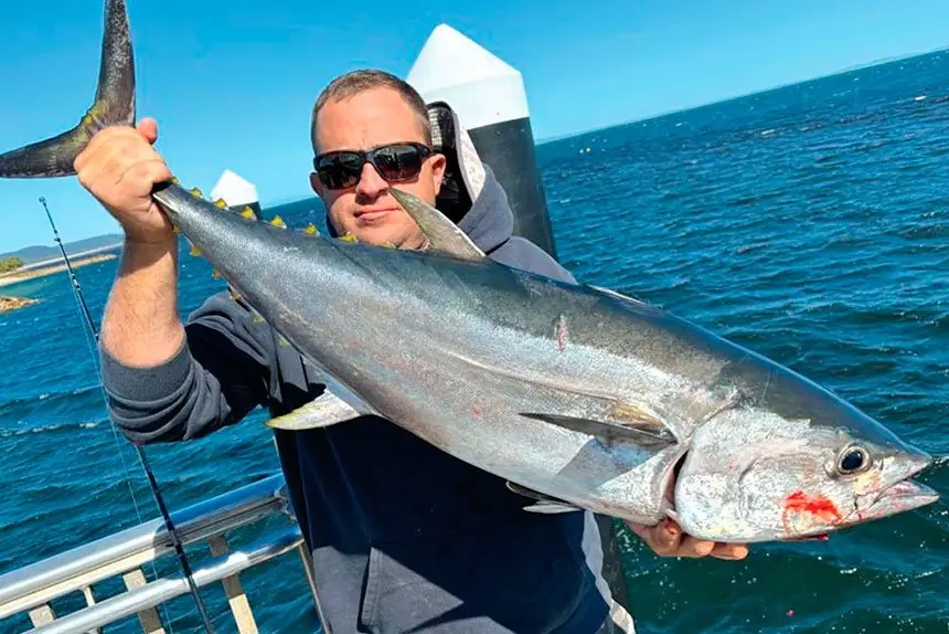 GOOD CATCH: Brent Greco with a long tail tuna caught at Amity Point, North Stradbroke Island.