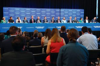 Queensland Premier David Crisafulli (middle) and others speak to a media panel after the announcement of the Games Delivery Plan for the 2032 Olympics and Paralympics.