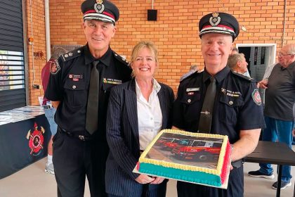 Superintendent Graeme Hall, Mayor Jos Mitchell and Brenden Flynn celebrate the 50th anniversary of the Cleveland Fire Station.