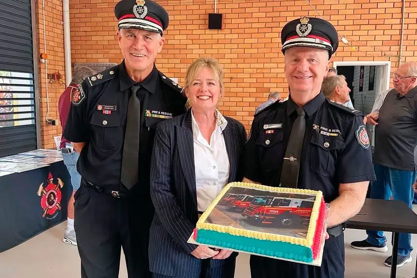 Superintendent Graeme Hall, Mayor Jos Mitchell and Brenden Flynn celebrate the 50th anniversary of the Cleveland Fire Station.