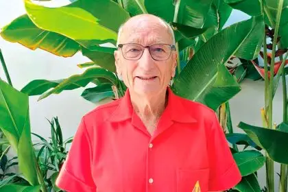 GOING STRONG: Ross Smith is still proud to wear his Apex Club shirt after 44 years.