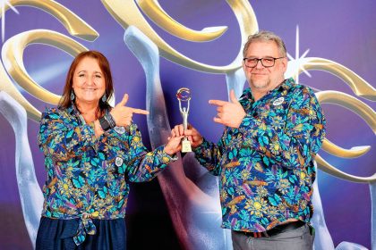 GRINNING WINNERS: Tracy and Martin Robson accepting their national award in Sydney.