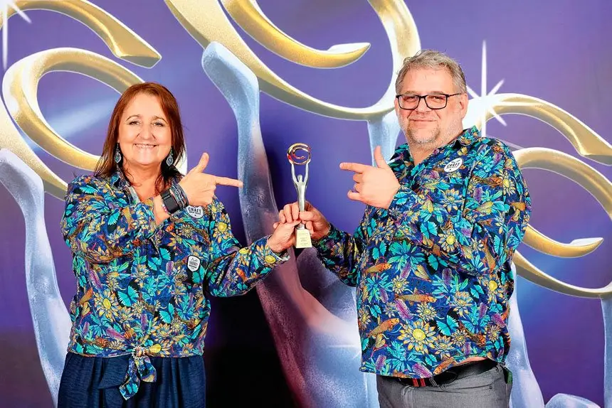 GRINNING WINNERS: Tracy and Martin Robson accepting their national award in Sydney.