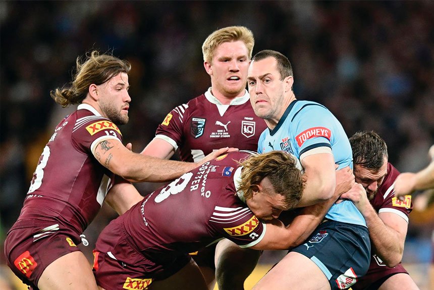 Blues captain Isaah Yeo is tackled by Reuben Cotter during last year’s State of Origin. PHOTO: AAP Image/Darren England)