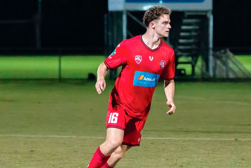 EARLY ACTION: Redlands defender Josh Masters came off the bench earlier than expected after an early injury for the Red Devils. Photo: Ray Gardner