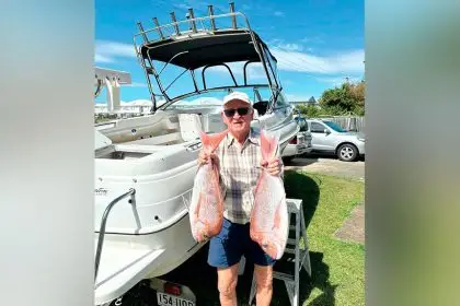 GOOD TIMES: Kevin Lowe has enjoyed a lifetime of fishing – he is holding a couple of snapper caught about 3km off Point Lookout.