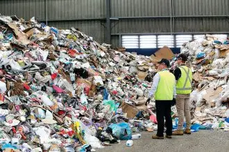Waste destined for landfill can be seen among recyclable items from domestic bins at the Cleanaway Recycling Centre.