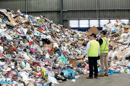 Waste destined for landfill can be seen among recyclable items from domestic bins at the Cleanaway Recycling Centre.