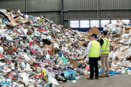 Waste destined for landfill can be seen among recyclable items from domestic bins at the Cleanaway Recycling Centre.
