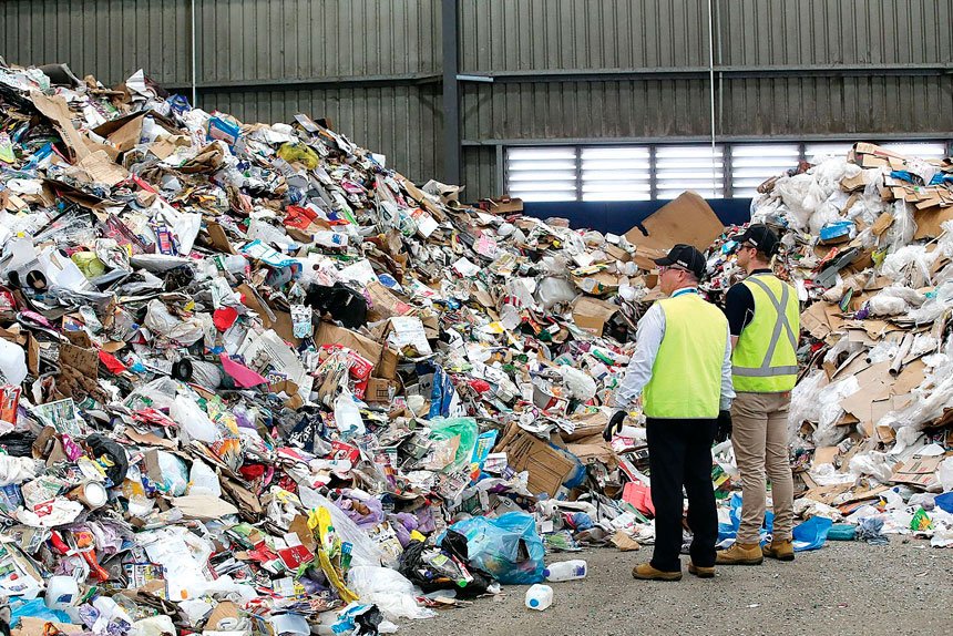 Waste destined for landfill can be seen among recyclable items from domestic bins at the Cleanaway Recycling Centre.