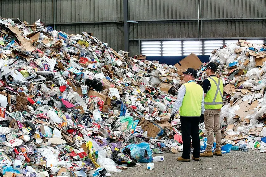 Waste destined for landfill can be seen among recyclable items from domestic bins at the Cleanaway Recycling Centre.
