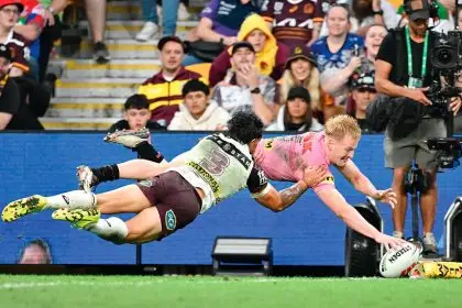 Panthers flyer Thomas Jenkins scores during the NRL Round 9 clash with the Brisbane Broncos. PHOTO: AAP Image/Dave Hunt