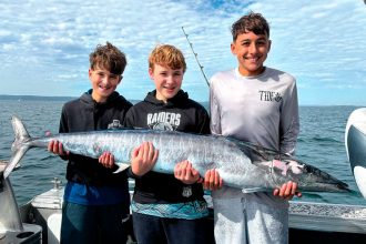FUN TIMES: Xavier Caputa, Willem Fens and Cooper Knezevic with a 40kg wahoo caught offshore from North Stradbroke Island on Xavier’s 13th birthday.