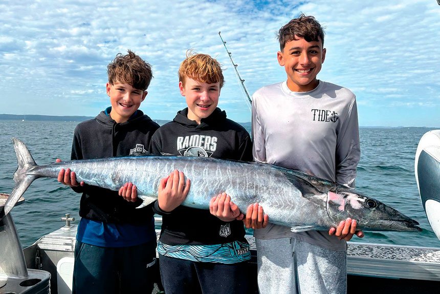 FUN TIMES: Xavier Caputa, Willem Fens and Cooper Knezevic with a 40kg wahoo caught offshore from North Stradbroke Island on Xavier’s 13th birthday.