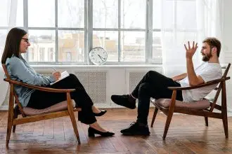 TALKING IT OUT: A trained therapist helps a client to understand patterns in their thoughts and feelings.