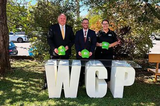 CELEBRATING: From left: State Member for Capalaba Russell Field, United Community Services General Manager Ronan Wicks and Wynnum Community Place Coordinator Lauren Andreatta.