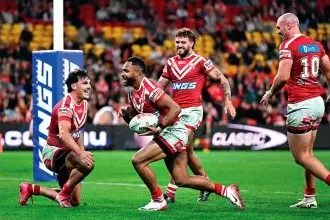 Hamiso Tabuai-Fidow of the Dolphins scores his second of four tries during the NRL Round 17 match between the Dolphins and the Rabbitohs. PHOTO: AAP Image/Dave Hunt