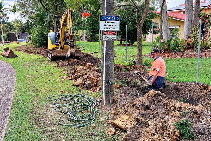 Fernando digging a trench at his own expense in an attempt to fix the issue.