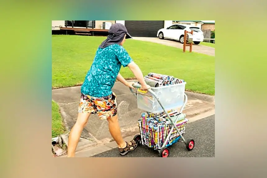 Joshua enjoys sorting the catalogues, rolling them, and loading up his delivery trolley.