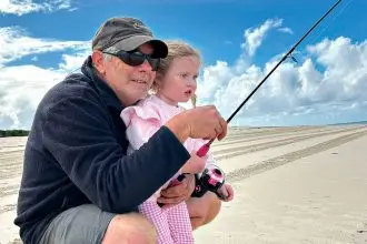 Oyster farmer and keen fisherman Wade McFadgen passes on his fishing skills to his granddaughter on Moreton Island.