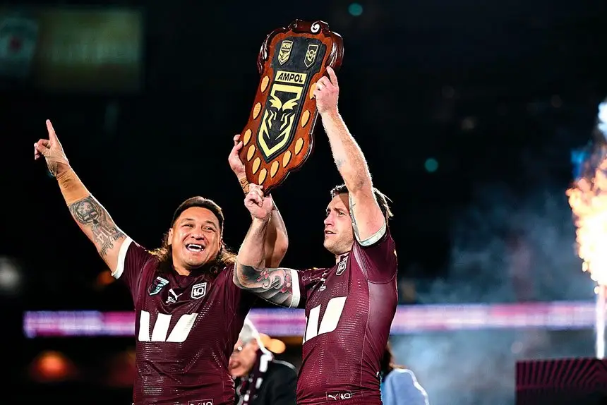 Josh Papalii and Cameron Munster following the Maroons’ series win in the State of Origin. PHOTO: AAP Image/Dan Himbrechts