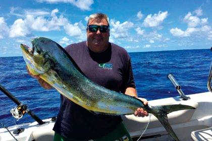 CATCH OF THE DAY: Ron Wilkinson with his 12kg mahi-mahi in Moreton Bay..