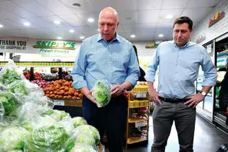 Former Opposition Leader Peter Dutton and Federal Member for Bowman Henry Pike inspect produce at Skippy’s Fresh Frootz in Victoria Point.