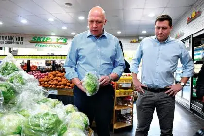 Former Opposition Leader Peter Dutton and Federal Member for Bowman Henry Pike inspect produce at Skippy’s Fresh Frootz in Victoria Point.