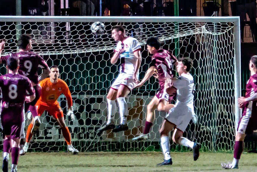Redlands’ man of the match Deegan Brook heads home his team’s solitary goal. Photo: Ray Gardner