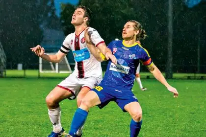 Redlands captain Noah Hitchcock and Strikers captain Matt Thurtell jostle for possession. PHOTO: Ray Gardner