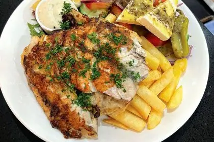 The grilled barramundi, chips and salad.