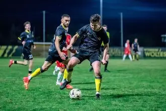Zach Maltby controls the ball, ready for another Wolves attack on the Olympic FC goal.