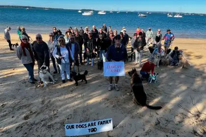 Residents stage a beach protest against “heavy handed” Council dog enforcement.