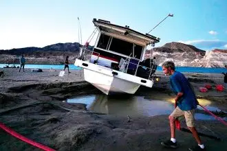 TIME TO GO: The abandoned houseboat is removed. (Not houseboat in story)