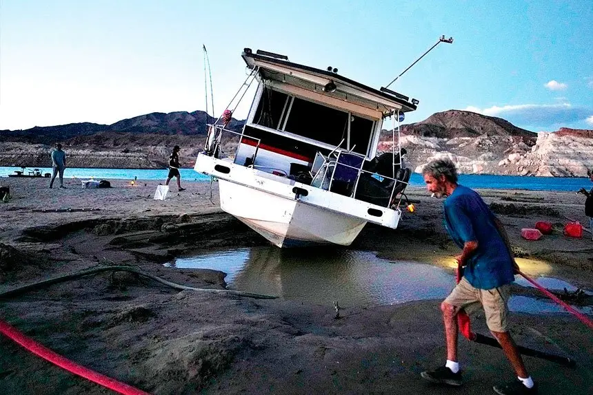 TIME TO GO: The abandoned houseboat is removed. (Not houseboat in story)