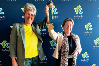 Natalie Cook and Mayor Jos Mitchell with Cook’s gold medal from the 2000 Sydney Olympics.