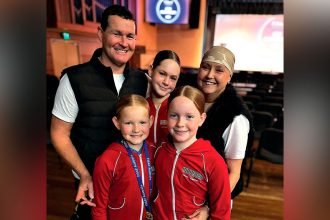 TRUE FIGHTER: Jodie Bromiley with her proud family.