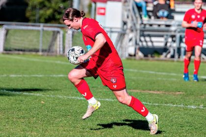 Redlands’ Angus Broderick takes the ball forward. Photos: Ray Gardner