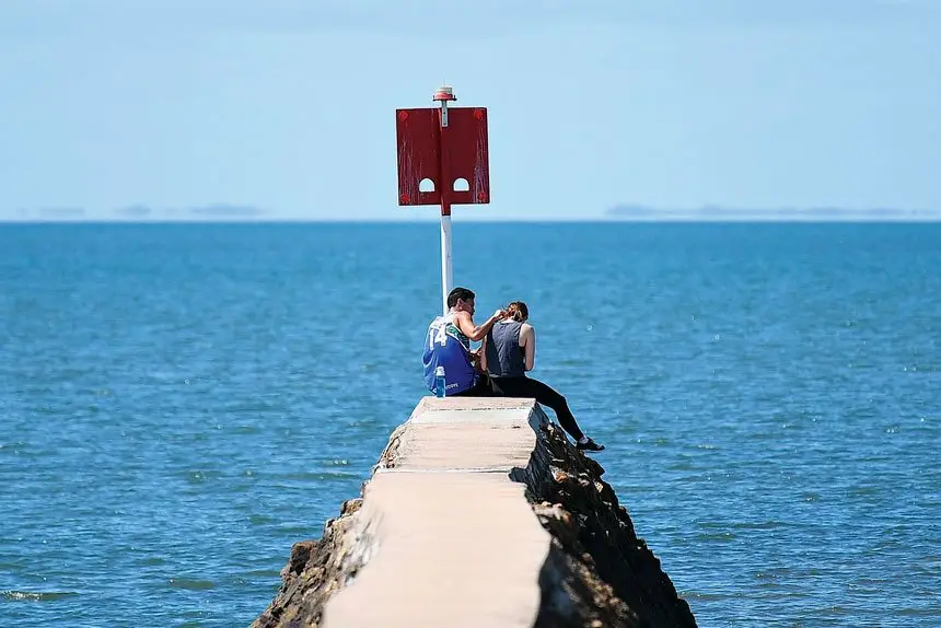 BAYSIDE BLISS: Relaxing along the Wynnum foreshore.